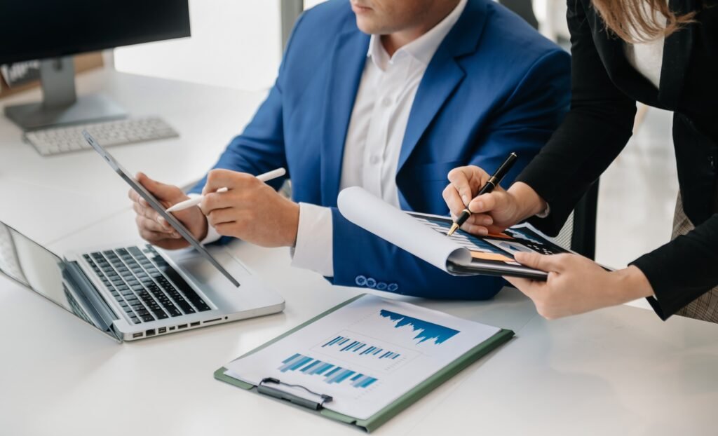 The business team analyzes revenue charts and graphs